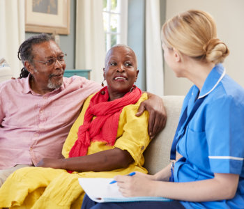 elderly couple and a caregiver