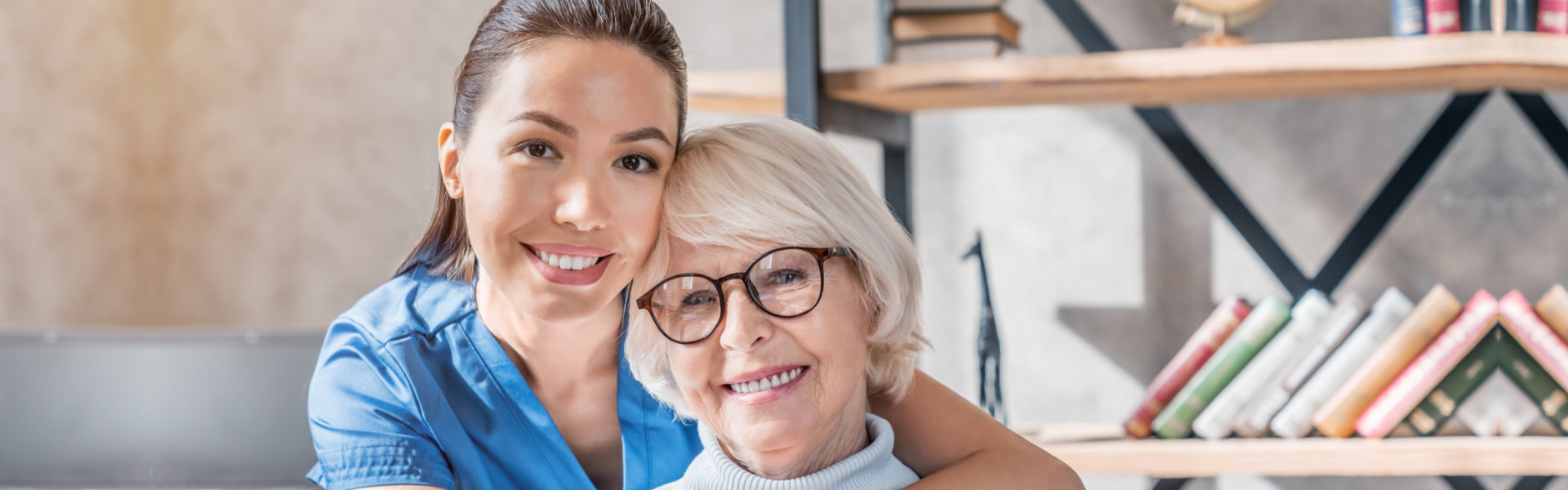 health professional woman and a senior woman smiling