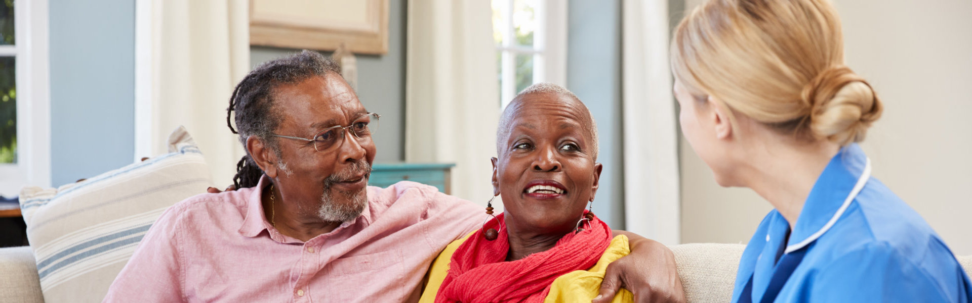 elderly couple and a caregiver